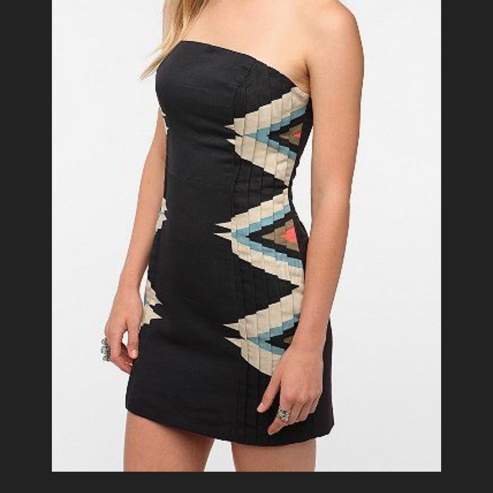 Pleated strapless mini dress, dark navy, tribal pattern to sides of dress.